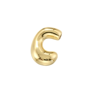 Macro shot of high-polish golden 3D bubble letter C pendant for jewelry making
