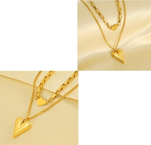 Detailed close-up of double-layer titanium steel heart pendant necklace in gold finish