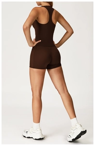 Rear view of brown racerback sports top and high-waisted shorts set on model