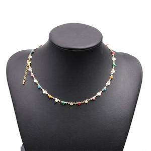Detail of colorful rainbow enamel heart chain necklace with gold adjustable clasp