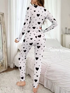 Back view of women's long-sleeve pajama set with heart print and ribbed fabric