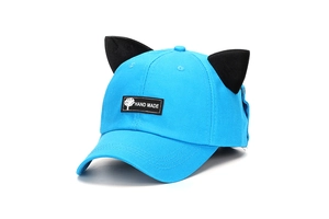 Detailed view of blue baseball cap with 3D cat ears and woven Hand Made patch
