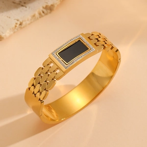 18K gold plated titanium steel bangle with black rectangular stone and crystal pavé details