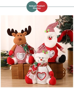 Close-up of DIY Christmas candy jars with Santa, reindeer and snowman felt characters