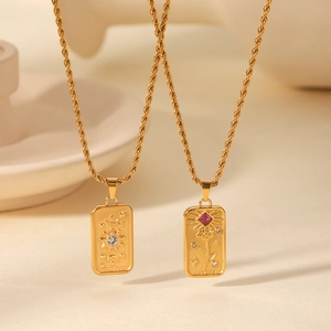 Detail of tarot card necklaces with SUN and LOVERS rectangular relief pendants
