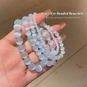 Stack of grey-blue cat eye stone beaded bracelets with distinct chatoyant optical effect