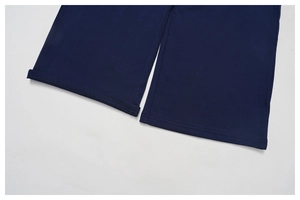 Macro shot of double-stitched hem and folded cuff details on navy high waist sweatpants