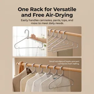 Gray non-slip seamless plastic clothes hanger with windproof hooks for closet storage