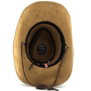 Macro view of inner sweatband and brand logo inside the brown suede cowboy hat