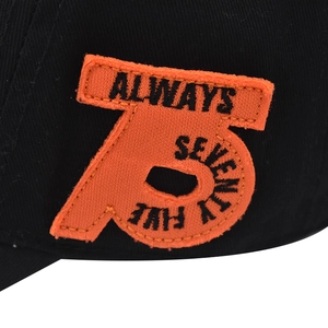 Close-up of orange 75 embroidery and Always text on black cotton baseball cap