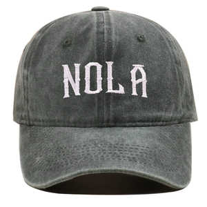 Detailed view of the white 3D NOLA embroidery on a vintage washed grey baseball cap