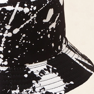 Streetwear ink splash bucket hat in black and white cotton with reinforced stitching