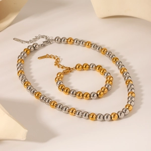 Parure collier et bracelet bicolore avec perles dorées et argentées et fermoir homard