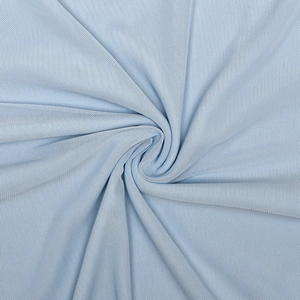 Close-up of light blue mesh fabric texture showing soft spiral drapes and material detail