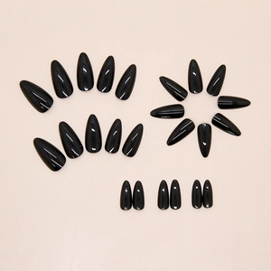 Glossy black medium-long almond fake nails set with 24 pieces in a minimalist display