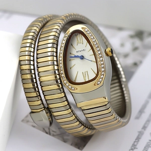 Close-up of a snake-shaped quartz watch featuring a crystal-set bezel and two-tone band
