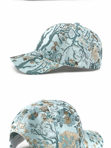 Detail of light blue jacquard baseball cap with traditional Chinese floral embroidery