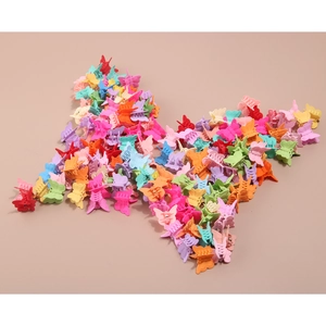 Creative butterfly-shaped arrangement of colorful mini matte plastic hair claw clips