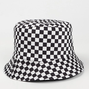 Detailed view of the checkered canvas fisherman hat with high-quality fabric texture