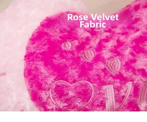 Detailed close-up of pink rose velvet fabric with heart embroidery and spiral texture