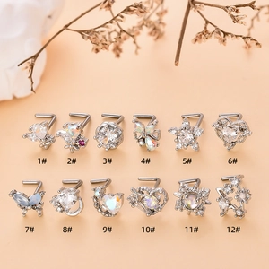 Set di 12 piercing per naso in acciaio inossidabile con zirconi a cuore e stella su arancio