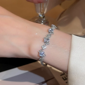 Detailed view of silver oval zircon bracelet with sparkling wavy gemstone setting