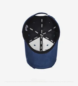 Detail of navy baseball cap interior with reinforced FBHS logo webbing and worn brim edges