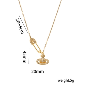 Chic gold Saturn safety pin pendant necklace with sparkling pavé crystals for women