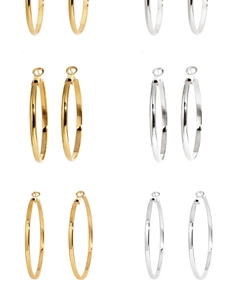 Detailed collection of polished gold and silver hoop earrings in various sizes and thicknesses