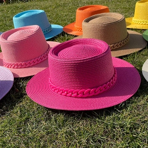 Colorful wide brim boater straw hats with stylish chain detail for summer beach vacations