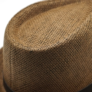 Close-up of the intricate cross-weave texture on this brown straw fedora hat