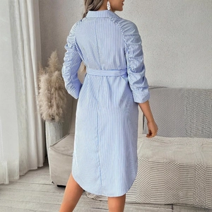 Back view of a blue striped maternity shirt dress with pleated sleeves and a waist belt