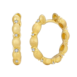 Brushed gold hoop earrings in 925 sterling silver with sparkling zircon accents