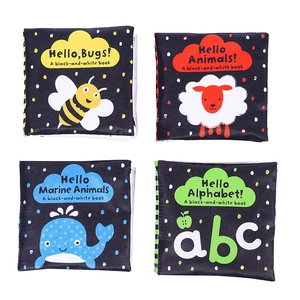 Macro view of four high-contrast black and white fabric baby books for early education