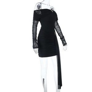 Detail of off-shoulder mesh sleeves and side drapes on the black bodycon mini dress