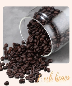 Macro detail of roasted coffee beans pouring from a clear borosilicate glass storage jar