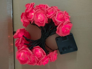 Outdoor LED solar rose flower fairy lights with pink blossoms and warm glow for garden decor
