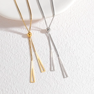 Adjustable gold and silver necklaces with hollow triangle pendants on a white surface