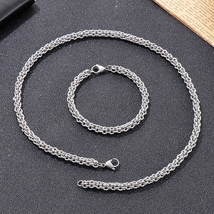 Detailed view of silver stainless steel braided chain necklace and bracelet set