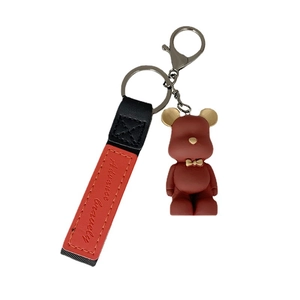 Nordic matte red bowtie bear keychain with black and red leather strap on white background