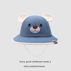 Detail of blue baby sun hat with 3D animal ears and cute bear face embroidery features
