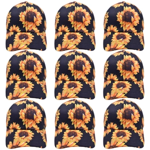 Grid view of black baseball caps featuring vibrant yellow sunflower floral patterns