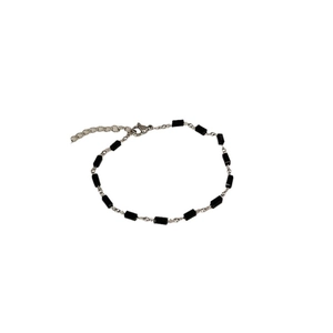 Minimalist Aurora crystal silver bracelet with black rectangular beads on white background