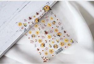 Detailed macro of TS-112 5D embossed nail decals with garden floral and bee patterns