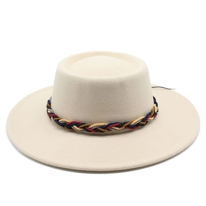 Detail of beige wide brim wool fedora with a colorful bohemian braided hat band