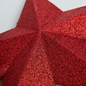 Red glitter Christmas tree topper star with sparkling textured finish for holiday decor
