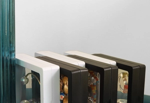 Close-up of black and white square PE film suspension boxes for jewelry display