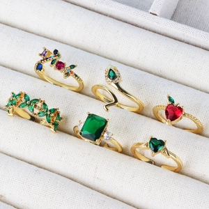 Golden open ring set with colorful zircon stones in heart, square and snake shapes