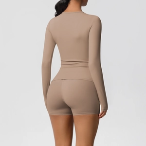 Close-up back view of tight khaki yoga set showing premium matte brushed fabric texture