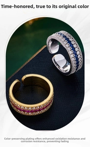 Detail view of adjustable rings with micro-set zircon stones on black jewelry box